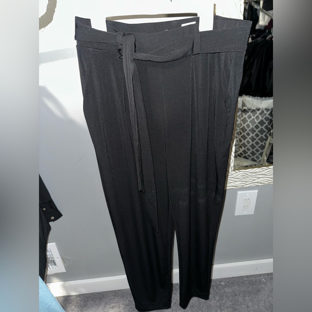 Black Express dress pants 
Jump suit Like pants material 
Never worn no tags